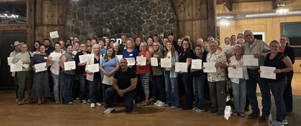 Participants gather for a group photograph with Empowering Minds in Kent County, Michigan.